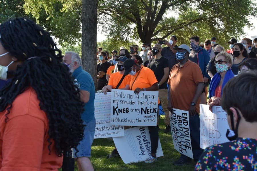 Signs held by protesters acknowledged the historic parallels between Floyd's death and events of the past. (Makenzie Plusnick/Community Impact Newspaper)