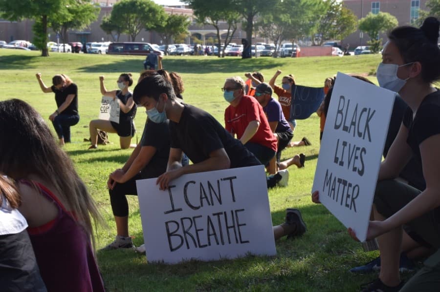Protesters knelt for 8 minutes and 46 seconds—the same amount of time that Minneapolis Police Officer Derek Chauvin had his knee on George Floyd's neck. (Makenzie Plusnick/Community Impact Newspaper)