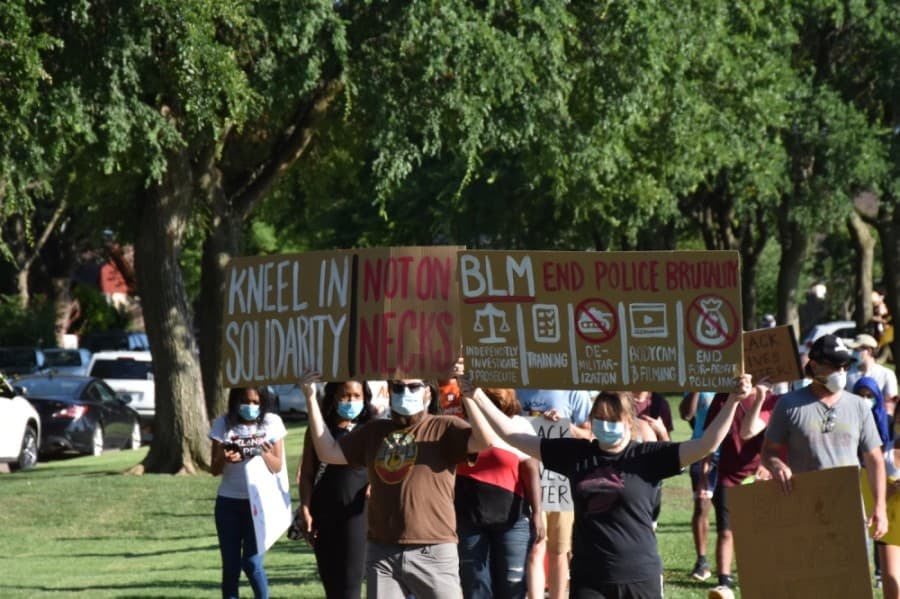 A procession around the park was accompanied by chants calling for an end to racial injustice and police brutality. (Makenzie Plusnick/Community Impact Newspaper)