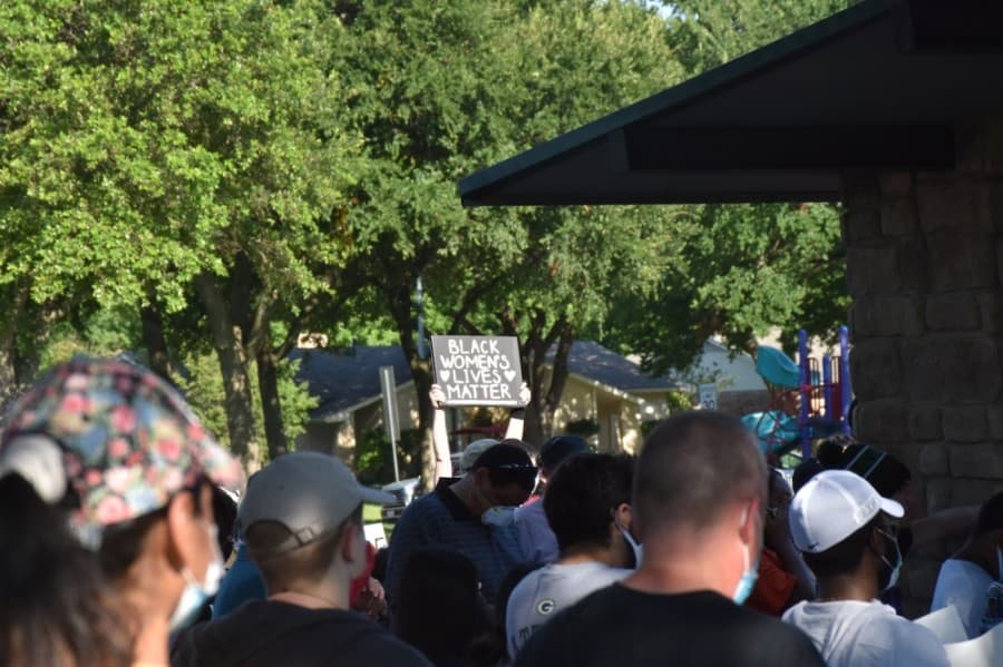 Signs at the protest included messages of intersectionality. (Makenzie Plusnick/Community Impact Newspaper)