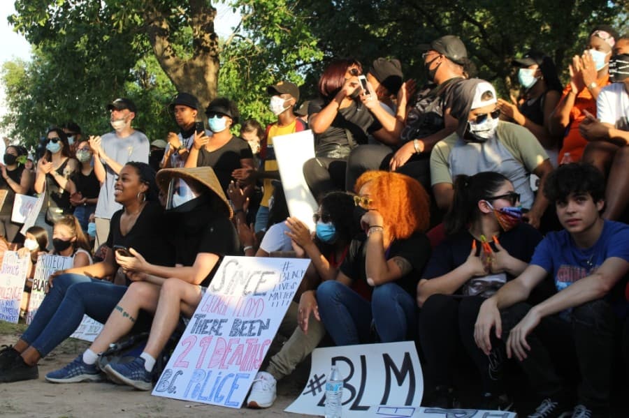 Demonstrators listened to several speakers after the march.  (Eva Vigh/Community Impact Newspaper)