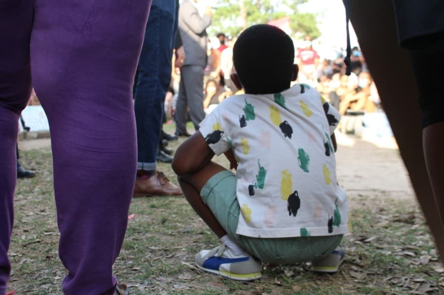 A boy listens to the speakers at the Katy for Black Lives Matter Protest held June 4 at Katy Park. (Eva Vigh/Community Impact Newspaper)