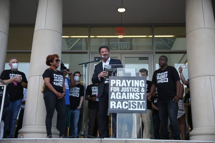 McKinney Mayor George Fuller took the stage to proclaim that every fifth weekend in his city would officially be a Unity Table day. (Liesbeth Powers/Community Impact Newspaper)