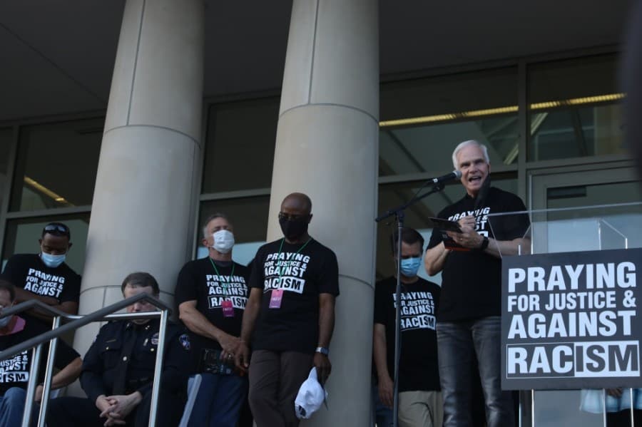Jim Johnson, senior pastor at Preston Trails Community Church, gives a second welcoming prayer to church members June 4. (Liesbeth Powers/Community Impact Newspaper)