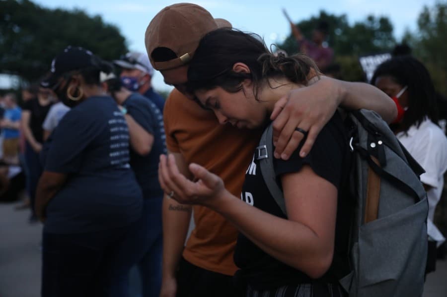Families were asked to pray together over what was said by pastors before the gathering ended. (Liesbeth Powers/Community Impact Newspaper)