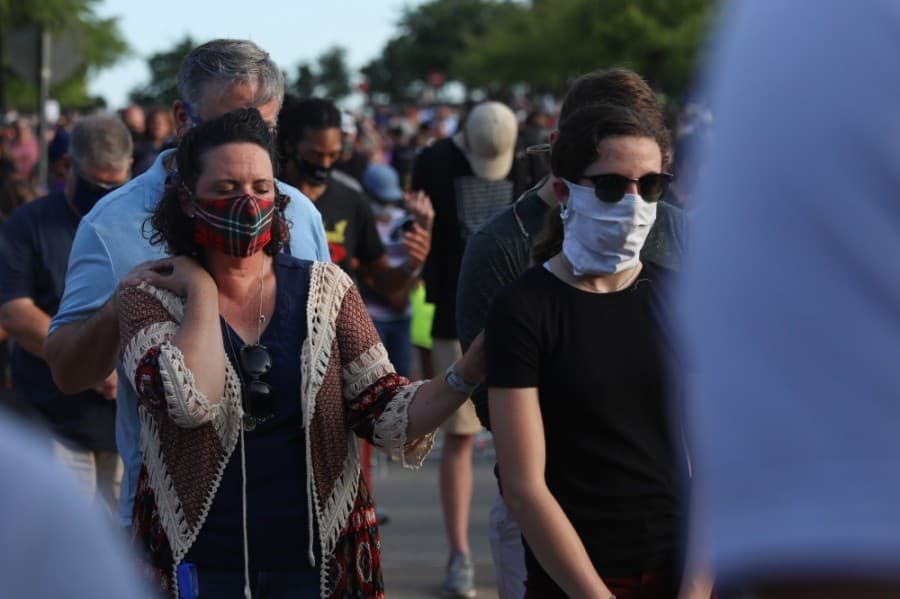 Many of those present wore masks and stood a few feet from one another with the exception of family members. (Liesbeth Powers/Community Impact Newspaper)
