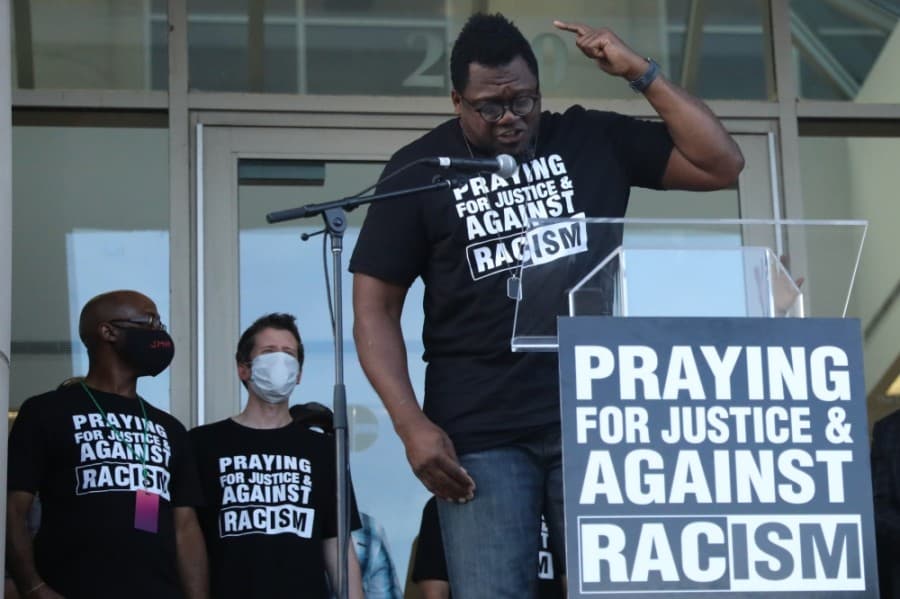 Derrick Golden, senior pastor at Amazing Church in McKinney, asked those present to help combat racism and continue discussions of justice in Collin County by taking part in the Unity Table. (Liesbeth Powers/Community Impact Newspaper)