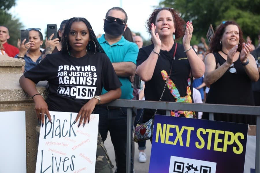 Standing among a crowd upward of a thousand, Chiamaka Duru (left), nodded in affirmation as pastors from more than 10 churches around Collin County prayed and spoke on racism and injustice. (Liesbeth Powers/Community Impact Newspaper)