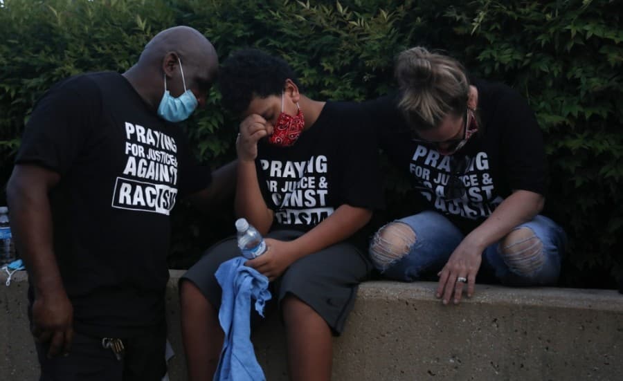 Families were asked to pray together over what was said by pastors June 4. (Liesbeth Powers/Community Impact Newspaper)