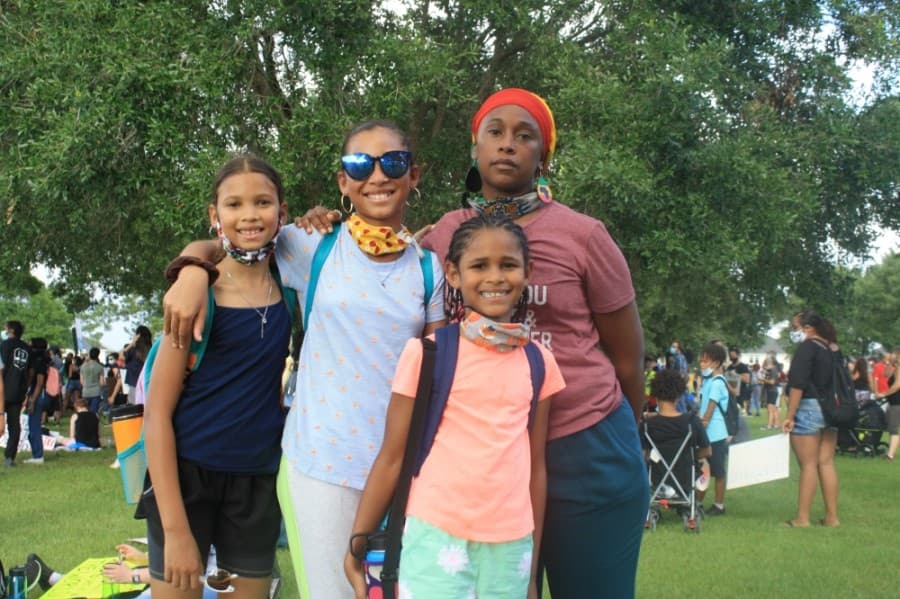 Amani Al Talib, back right, stands with three of her four children at the Katy for Black Lives Matter Protest held June 4 at Katy Park. "I fear for my children, I fear for my brother," Al Talib said. "Until all black lives matter, not all lives matter." (Jen Para/Community Impact Newspaper)