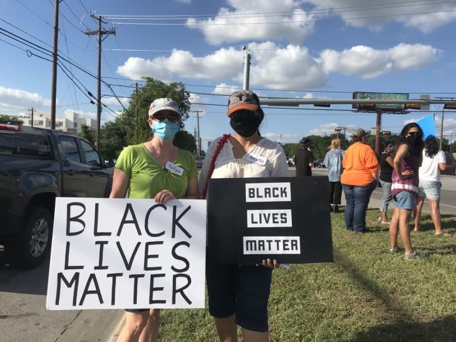  Tonya Frederic (left) and Amirta Adhikary (right) organized a protest on June 5 in the Four Points area. (Amy Rae Dadamo/Community Impact Newspaper)

