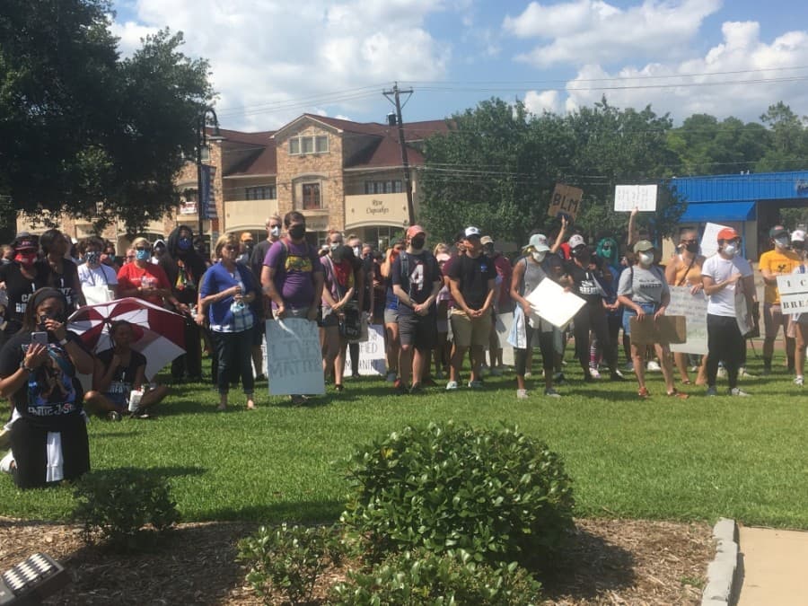 Protestors listened to people speak about racism they have faced. (Haley Morrison/Community Impact Newspaper)
