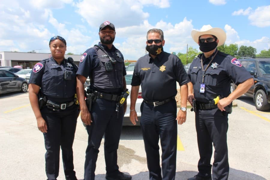 Officers from Constable Chris Diaz' office in Harris County Precinct 2 marched with the protestors. (Haley Morrison/Community Impact Newspaper) 