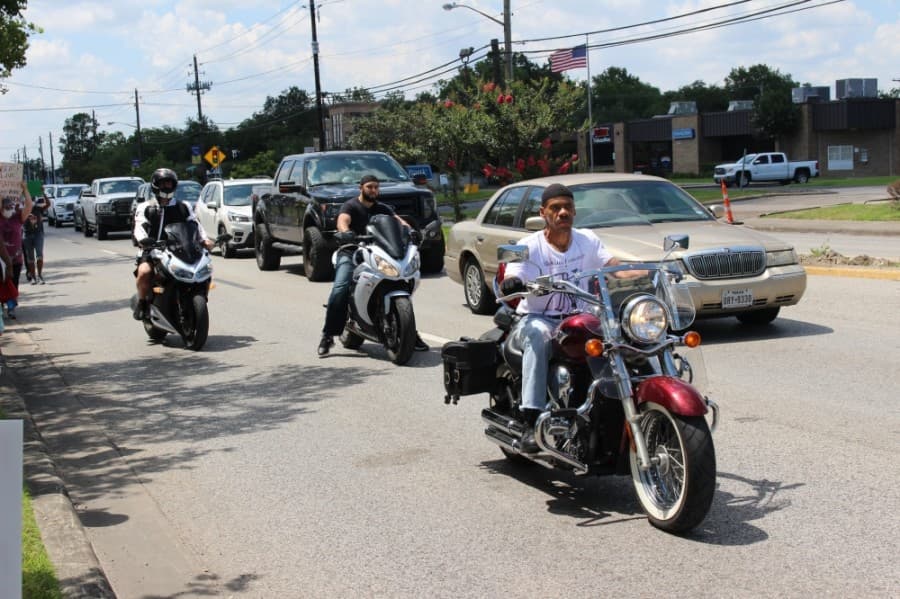 Motorcyclists rode alongside the marching protestors in solidarity. (Haley Morrison/Community Impact Newspaper) 