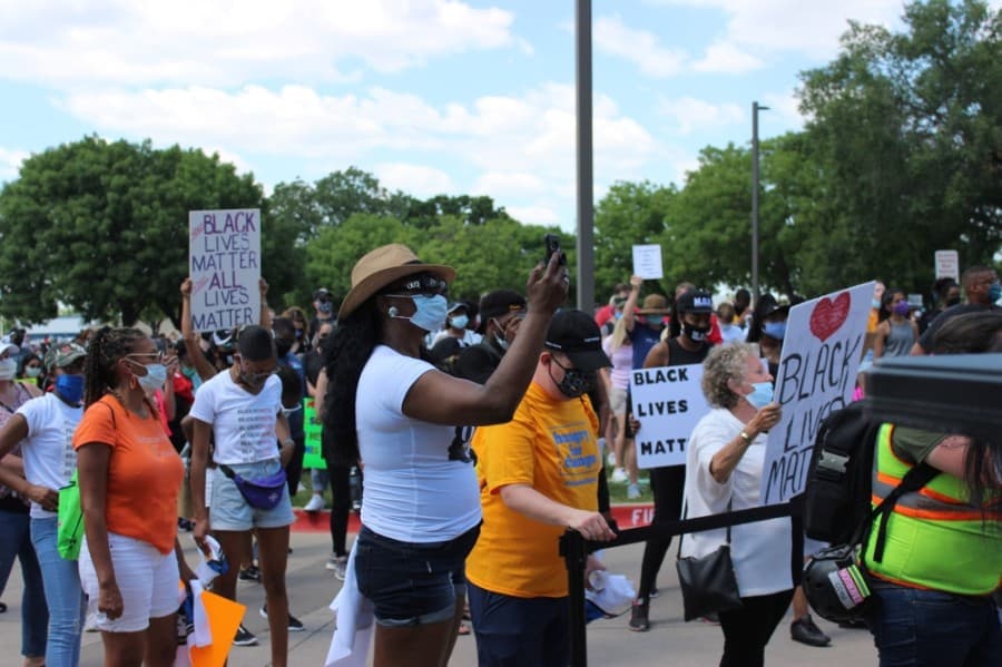 The crowd listens to a speaker June 7 outside the Plano Municipal Center at a rally in support of nationwide police reform. (Daniel Houston/Community Impact Newspaper)