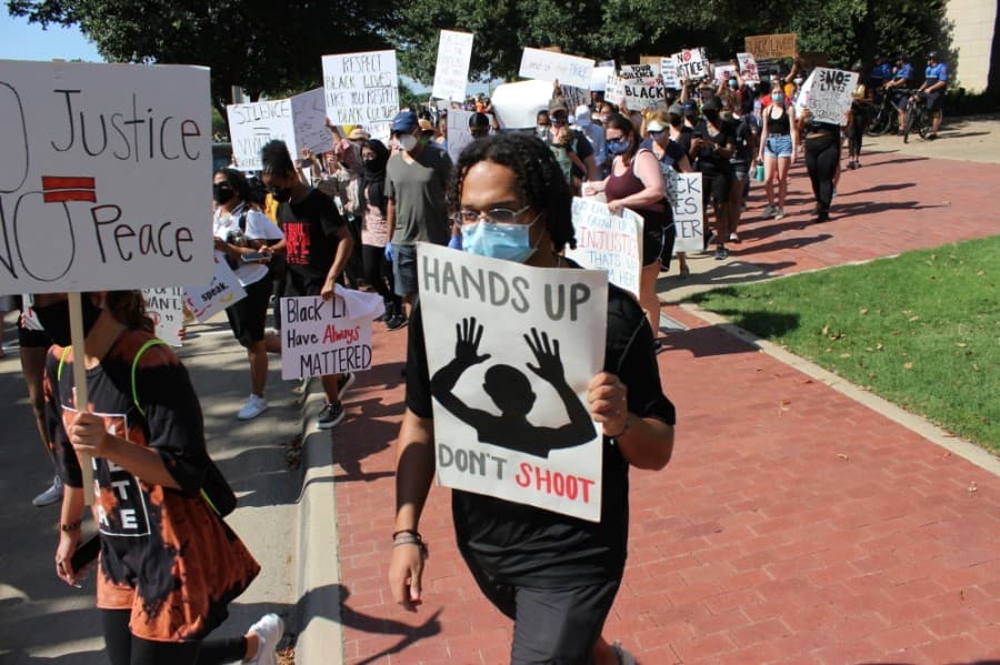 Peaceful protesters marched June 7 through the streets of downtown Plano to protest prominent instances across the country of police violence against black people. (Daniel Houston/Community Impact Newspaper)