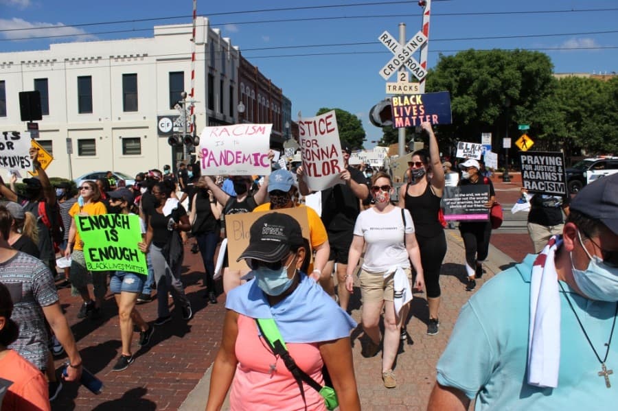 Peaceful protesters marched June 7 through the streets of downtown Plano to protest prominent instances across the country of police violence against black people. (Daniel Houston/Community Impact Newspaper)