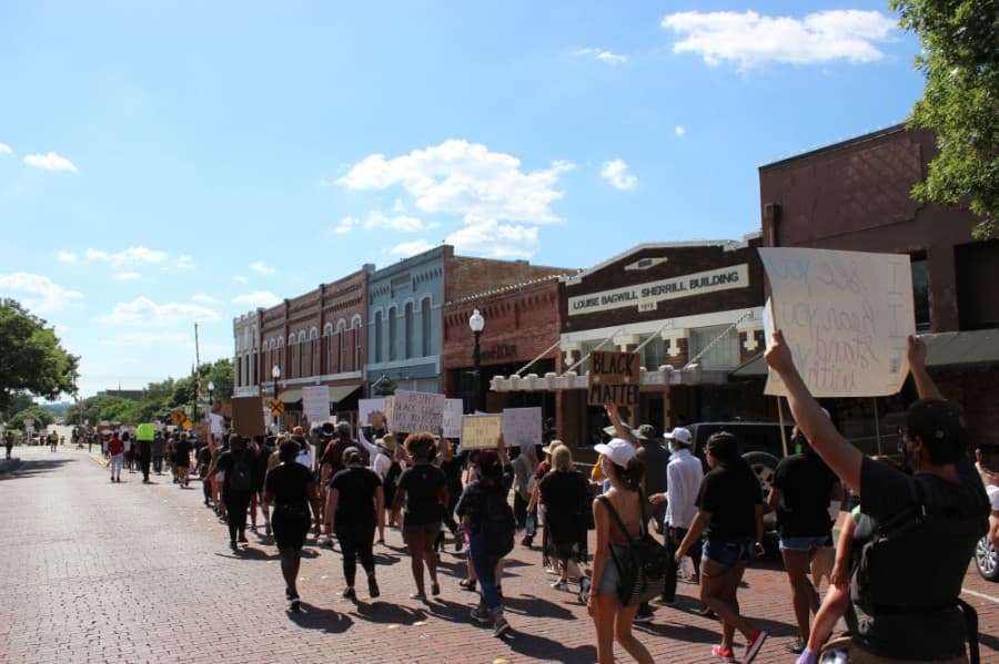 Peaceful protesters marched June 7 through the streets of downtown Plano to protest prominent instances across the country of police violence against black people. (Daniel Houston/Community Impact Newspaper)