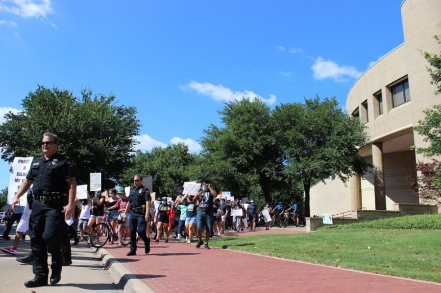 Peaceful protesters marched June 7 through the streets of downtown Plano to protest prominent instances across the country of police violence against black people. (Daniel Houston/Community Impact Newspaper)
