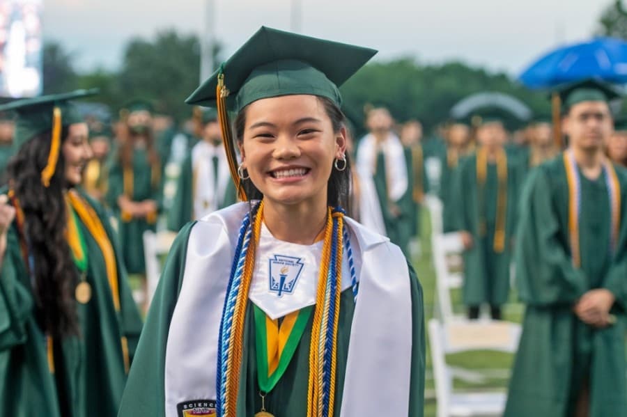 A Cypress Falls High School graduate smiles for the camera at a June 2 ceremony. (Courtesy Cy-Fair ISD)