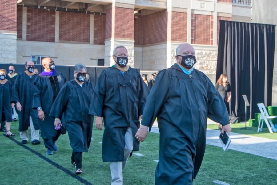 Members of the Cy-Fair ISD board of trustees file into the inaugural graduation ceremony for Cypress Park High School on June 6. (Courtesy Cy-Fair ISD)