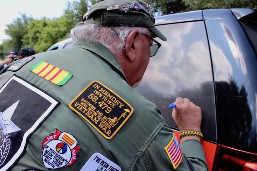 Evans and other veterans in attendance were invited to sign a Williamson County Sheriff's SUV dedicated to honoring individuals who have served in the U.S. military.