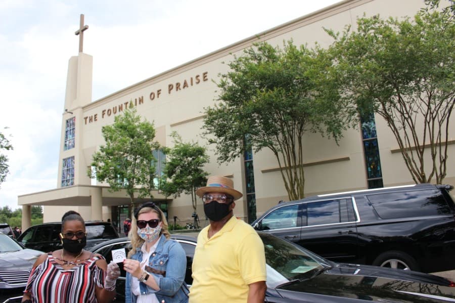 Lisa Mahlum (middle) and Beverly Austin (left), who both came to George Floyd's visitation from the Houston area, met for the first time while they were in line to pay their respects. (Beth Marshall/Community Impact Newspaper)