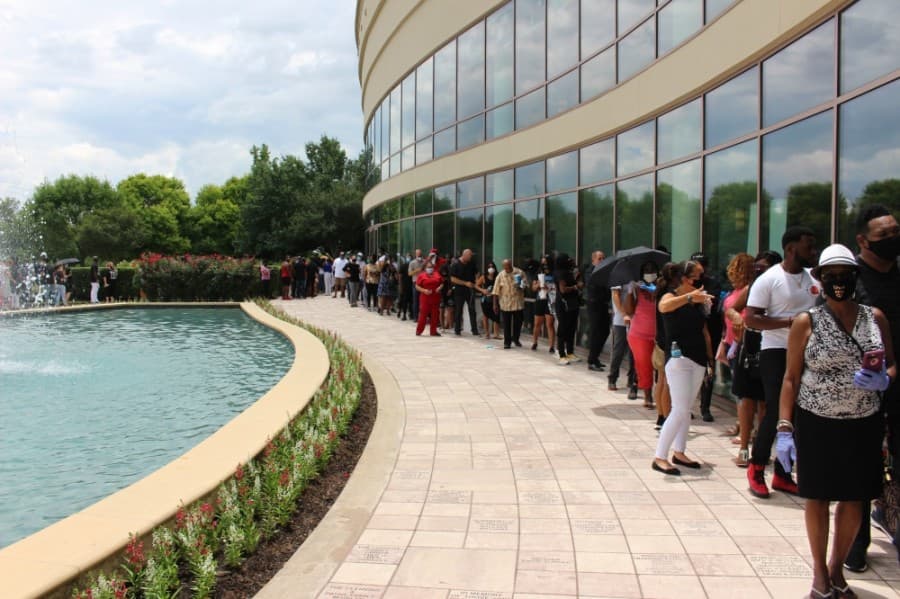 Because of social distancing measures, only about 10 attendees were allowed in the church at a time, so a line formed, which wrapped around the church and yard. (Beth Marshall/Community Impact Newspaper) 