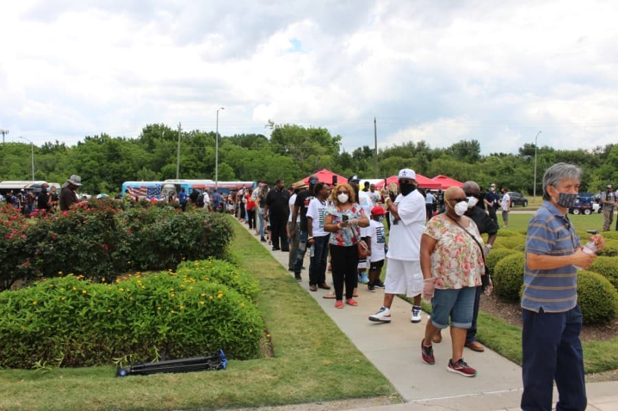 Because of social distancing measures, only 10 attendees were allowed in the church at a time, so a line formed, which wrapped around the church and yard. (Beth Marshall/Community Impact Newspaper)