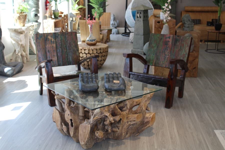 This chair set was made from wood salvaged from an Indonesian boat. (William C. Wadsack/Community Impact Newspaper)