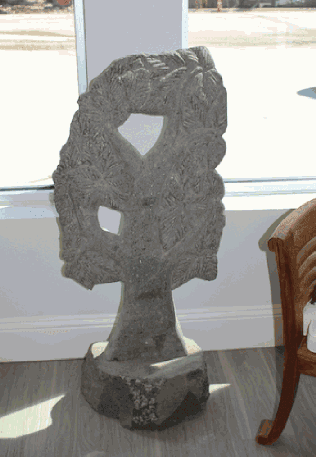Storied Roots’ statues are hand-carved from green lava stone or river stone or cast in concrete made from the excess shavings left over from carvings. (William C. Wadsack/Community Impact Newspaper)