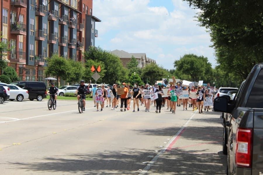 Police escorted protesters through Keller Town Center and halted traffic at Rufe Snow Drive. (Ian Pribanic/Community Impact Newspaper)