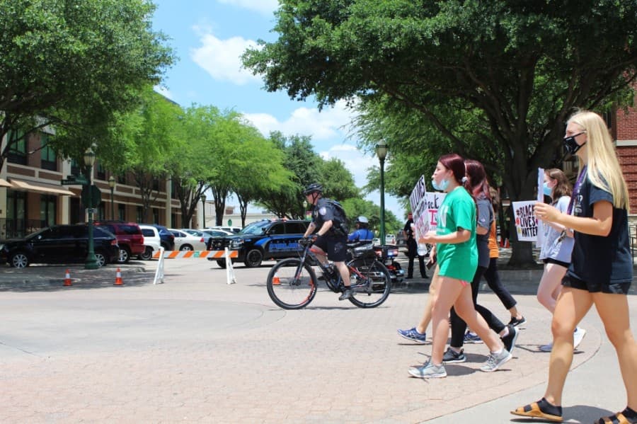 The Keller Police Department set up barricades to help ensure the safety of protesters near Keller Town Hall. (Ian Pribanic/Community Impact Newspaper)