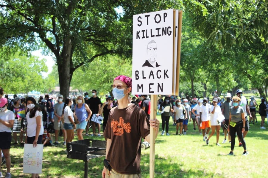 Protesters gathered at Bear Creek Park before marching to Keller Town Center. (Ian Pribanic/Community Impact Newspaper)