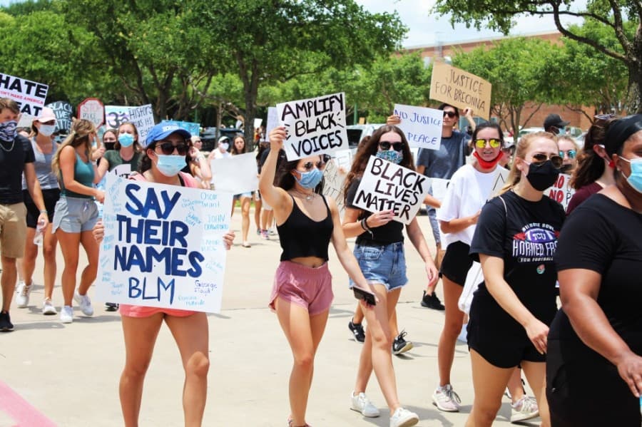 Protesters march passed Keller Town Hall during a George Floyd protest on June 7. (Ian Pribanic/Community Impact Newspaper)