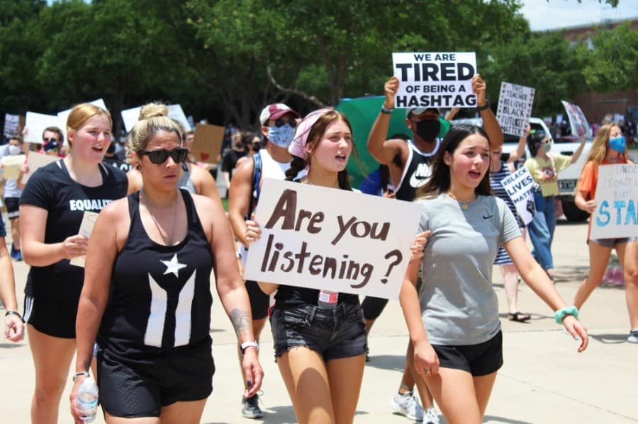 Protesters march passed Keller Town Hall during a George Floyd protest on June 7. (Ian Pribanic/Community Impact Newspaper)