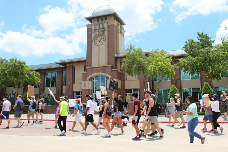 Protesters march passed Keller Town Hall during a George Floyd protest on June 7. (Ian Pribanic/Community Impact Newspaper)