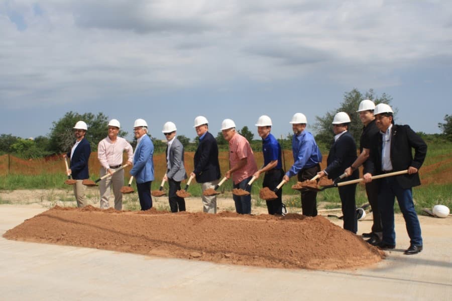 The landowners, pictured above with members of the Fulshear-Katy Chamber of Commerce, are paying 50% of the Texas Heritage Parkway construction costs, 100% of the design costs and the land for the parkway. They will also contribute $2 million for a trail system.  (Jen Para/Community Impact Newspaper)