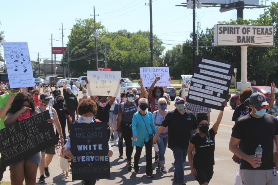 A few hundred protesters were escorted down West Main Street to City Hall on June 13 in a peaceful demonstration. (Dylan Sherman/Community Impact Newspaper)