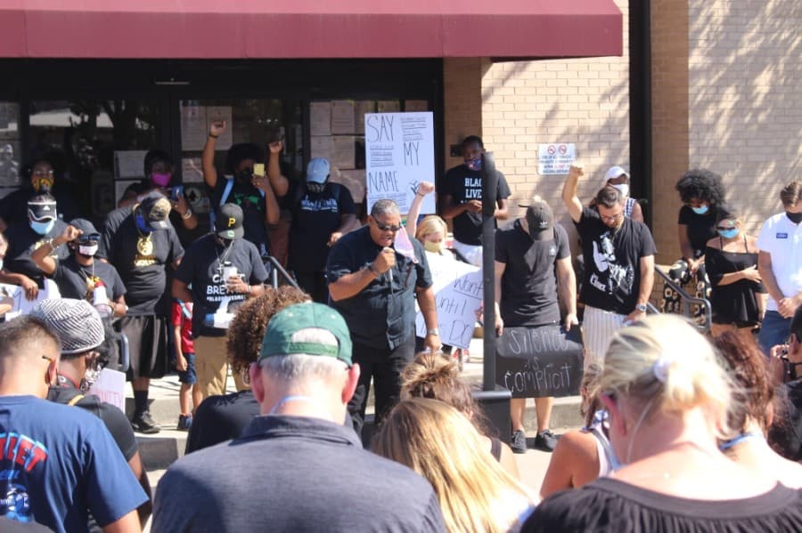Edward Matthews, a pastor at Newness of Life Worship Center, located on West Hufsmith Road in Tomball, led the crowd in prayer on June 13. (Dylan Sherman/Community Impact Newspaper)