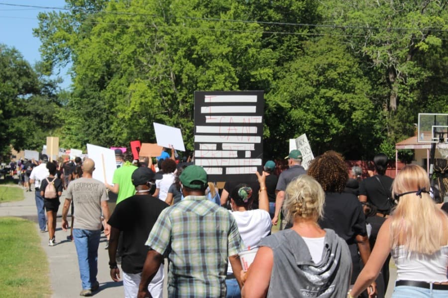 Protesters travel down Malone Street nearing City Hall on June 13. (Dylan Sherman/Community Impact Newspaper)