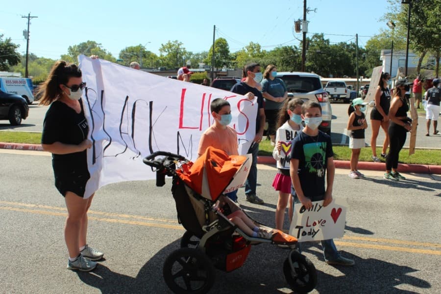 A group gathers in front of Tomball City Hall. (Anna Lotz/Community Impact Newspaper)