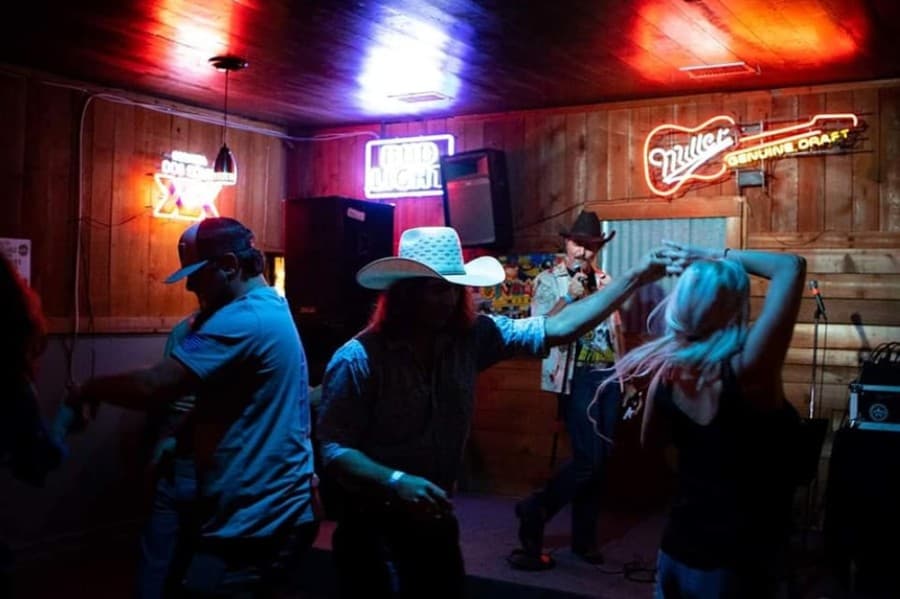 A photo of people dancing at Last Chance Bar & Dancehall