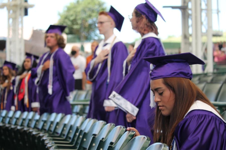 Several students kneeled during the National Anthem. (Andy Li/Community Impact Newspaper)