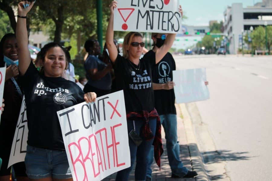 Protestors gather in downtown Conroe. (Andy Li/Community Impact Newspaper)