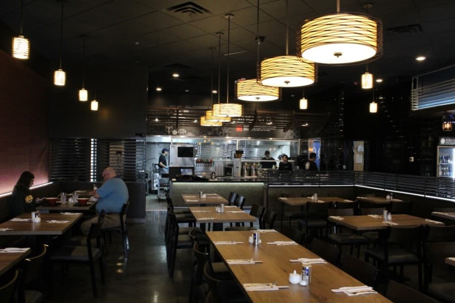 Nikugen Steak & Ramen offers a nontraditional hibachi restaurant setup; its food is prepared in an open kitchen, not at each customer's table. (Elizabeth Ucles/Community Impact Newspaper)