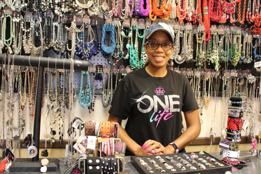 LaTrisa Edwards is the owner of STS   Accessories, a salon that also features an adjoining accessories center. (Olivia Lueckemeyer/Community Impact Newspaper)
