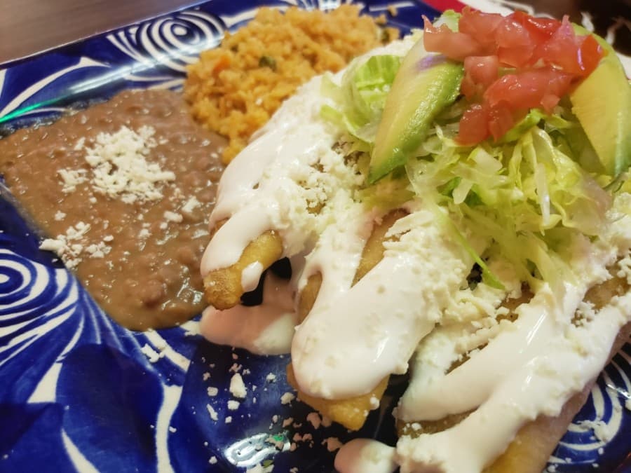 Nena's Cazuelas offers chicken empanadas as one of its many dishes. (Ali Linan/Community Impact Newspaper)
