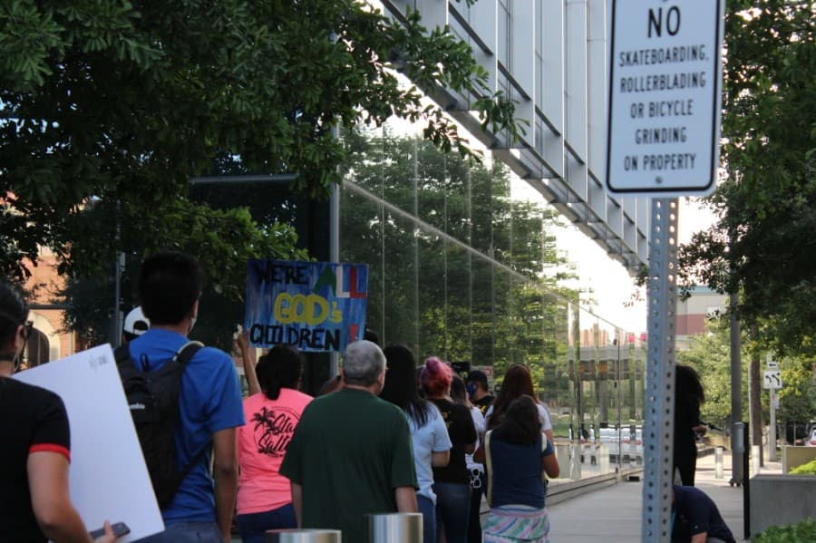 DACA supporters marched around the Mickey Leland Federal Building in Houston Thursday evening to demonstrate their support of the June 18 U.S. Supreme Court decision to uphold the Deferred Action for Childhood Arrivals immigration policy. (Adriana Rezal/Community Impact Newspaper)