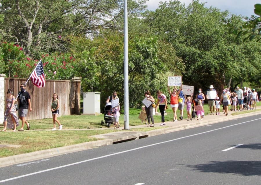 Southwest Austin families participate in neighborhood march to support justice and racial equity